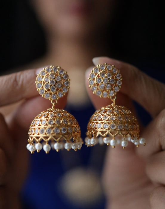 Heritage gold plated white stone jumka earrings 1246751