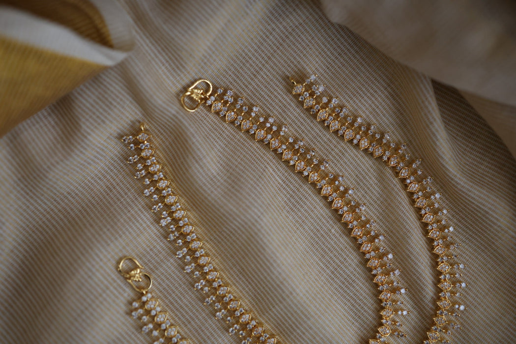 Heritage gold white stone traditional payal HAN12165
