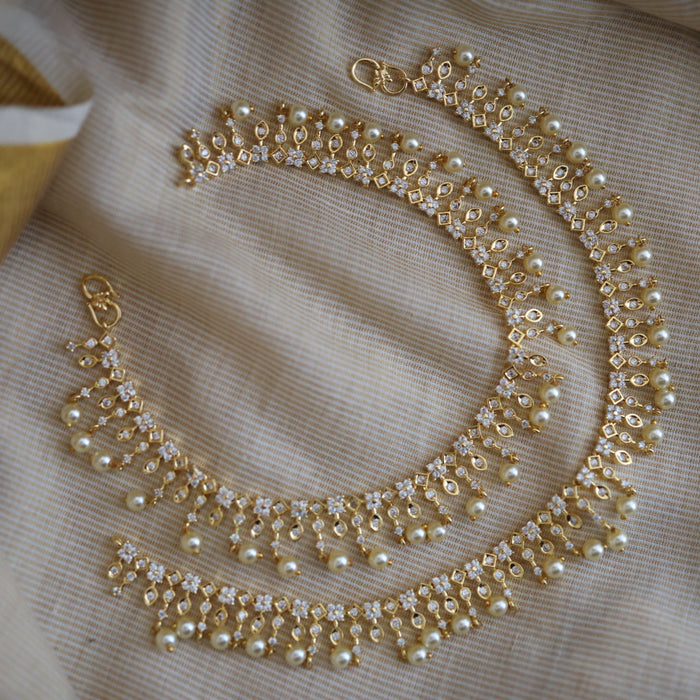 Heritage gold white stone and pearl traditional payal AN12155