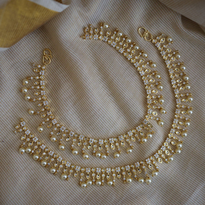 Heritage gold white stone and pearl traditional payal AN12155