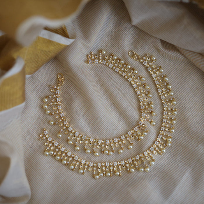 Heritage gold white stone and pearl traditional payal AN12155
