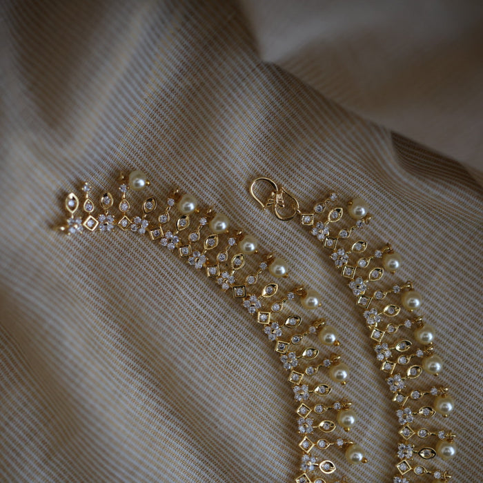 Heritage gold white stone and pearl traditional payal AN12155