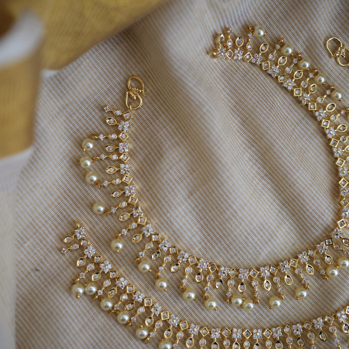 Heritage gold white stone and pearl traditional payal AN12155