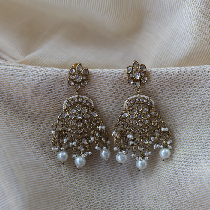 Trendy white stone drop earrings and tikka TJ6822