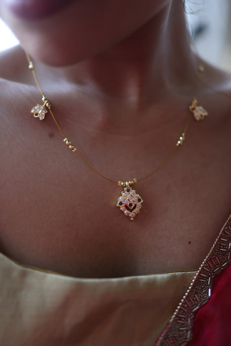 Heritage gold plated ruby white invisible short necklace IN903