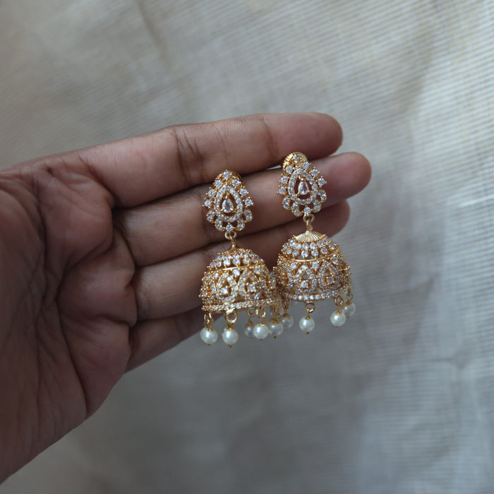 Heritage gold plated white stone jumka earrings  HJ1445