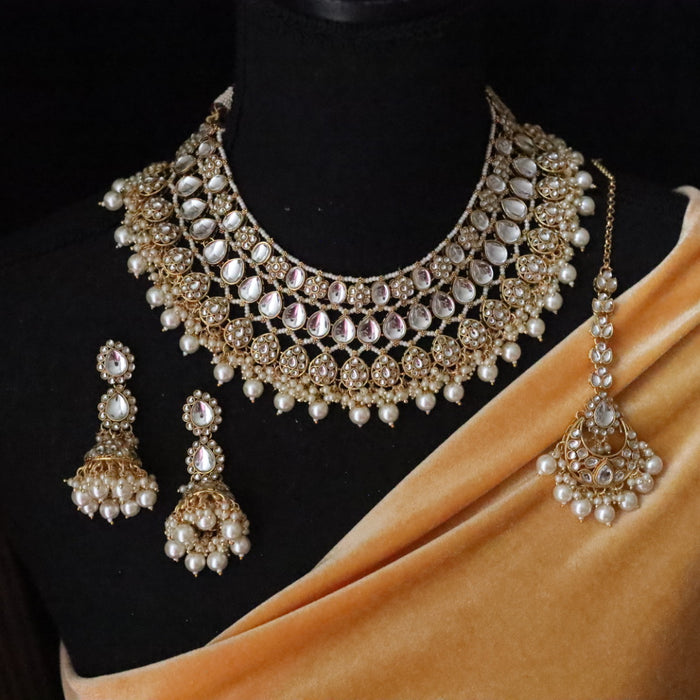 Trendy white stone short necklace with earrings and tikka 134505
