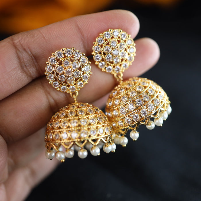 Heritage gold plated white stone jumka earrings 1246751