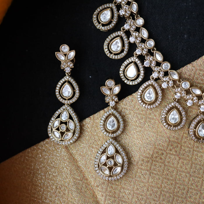 Trendy white short necklace with earrings and tikka 14854111