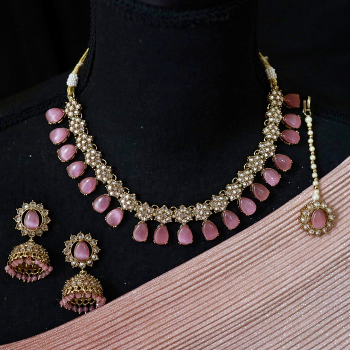 Trendy pink bead choker necklace with earrings and tikka 644333