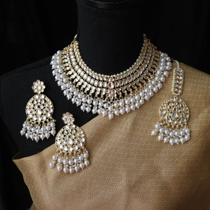 Trendy white bead short necklace with earrings and tikka 485566