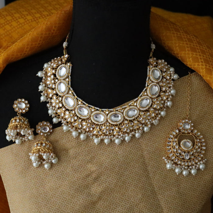 Heera white Kundan stone and pink pearls necklace with earrings and tikka 176312