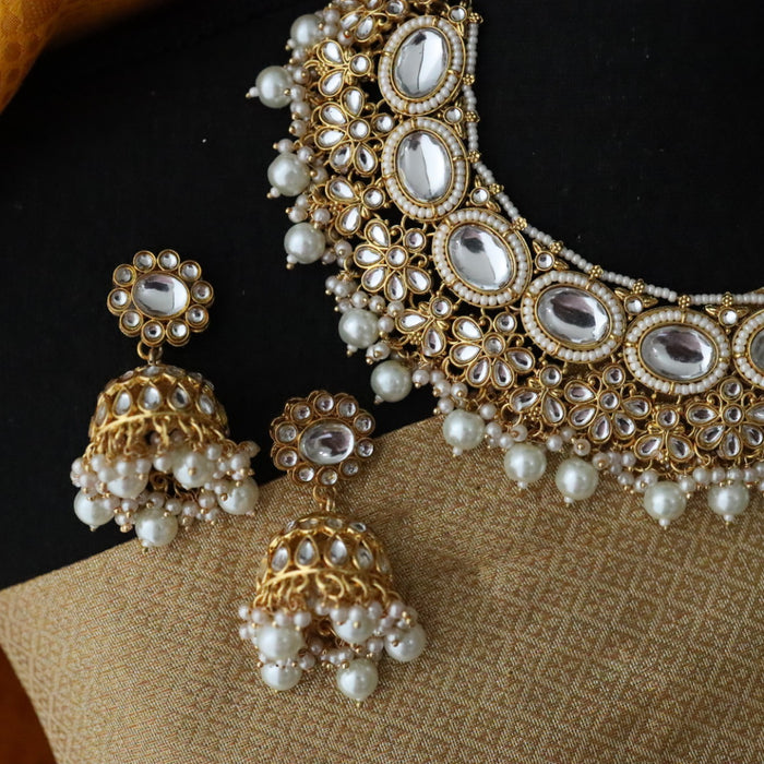 Heera white Kundan stone and pink pearls necklace with earrings and tikka 176312