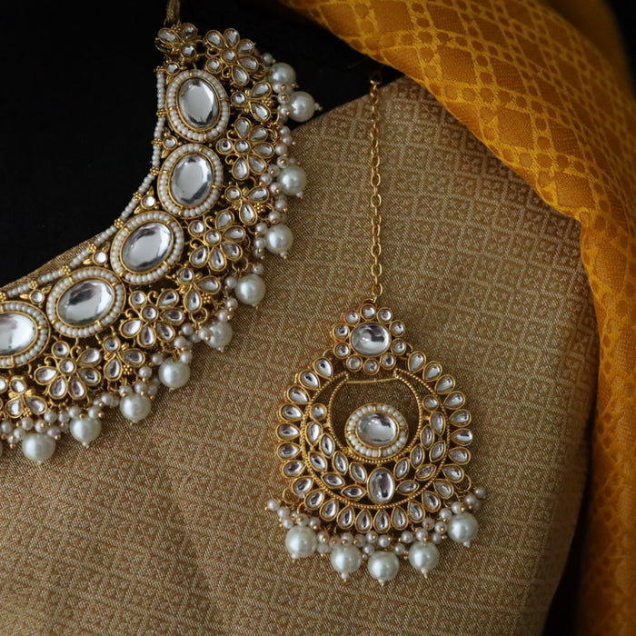 Heera white Kundan stone and pink pearls necklace with earrings and tikka 176312