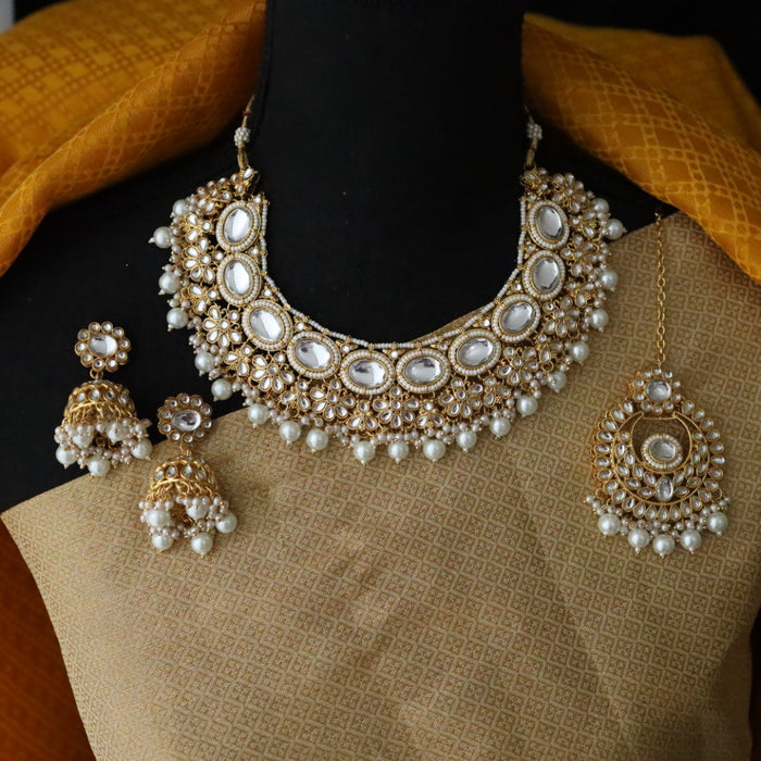 Heera white Kundan stone and pink pearls necklace with earrings and tikka 176312