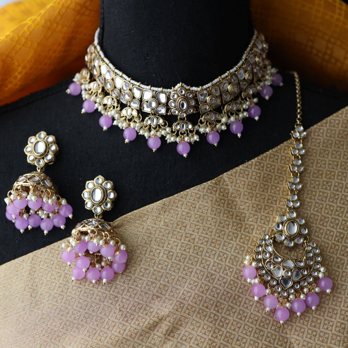 Heera white Kundan stone and purple pearls choker with earrings and tikka 1763340