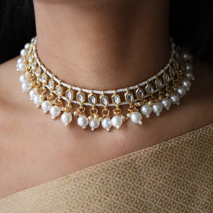 Trendy white bead choker necklace with earrings and tikka 543331